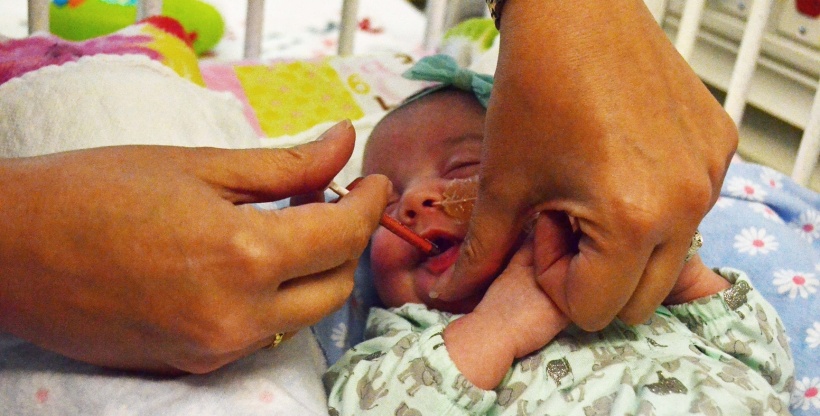 A baby in the neonatal intensive care unit receives a vitamin D supplement.