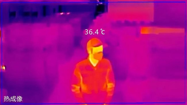 thermal image of a man wearing a cap and protective mask