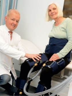 Ivo Buschmann fits a patient with a personal shear rate therapy system....