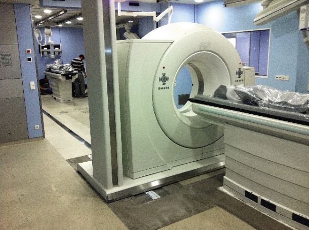 The worldwide unique sliding gantry CT scanner slides on a rail system.