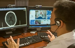 Tzu-Ching Wu, M.D., talks to a patient via telemedicine at The University of...