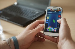 This image shows playing Tetris on a smartphone.