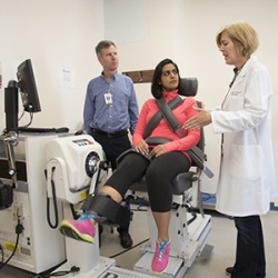 Cardiology fellow Nishtha Sodhi, MD, (center) demonstrates equipment used to...