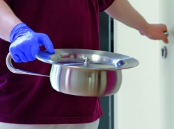 When you leave a patients room with a full bedpan, its important to ensure that...