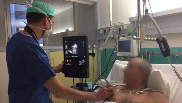 Dr Christophe Aveline uses the S-Nerve™ for a bedside ultrasound scan.