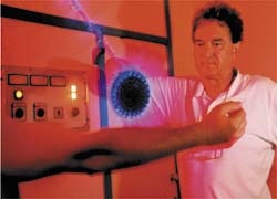 Dr Peter Nuhr demonstrating an electric shower