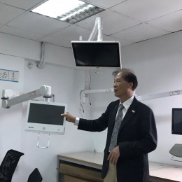 man presenting medical monitors