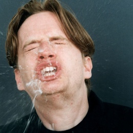 sneezing man