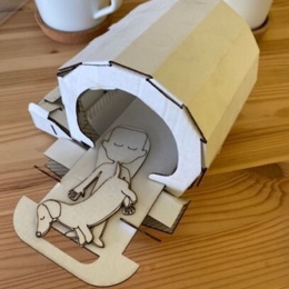 The playkit includes a cardboard kit MRI scanner, into which the child can...