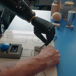 Experimental tests on robotic prosthesis: patient cuts an object with a knife