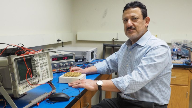 Professor Omar Ramahi sitting in his lab. 