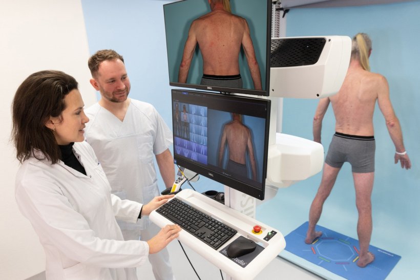 dermatologists performing full-body scan for skin cancer screening