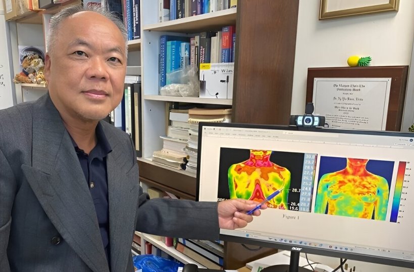 NTU Assoc Prof Eddie Ng Yin Kwee demonstrating thermal images of taken by PINN,...