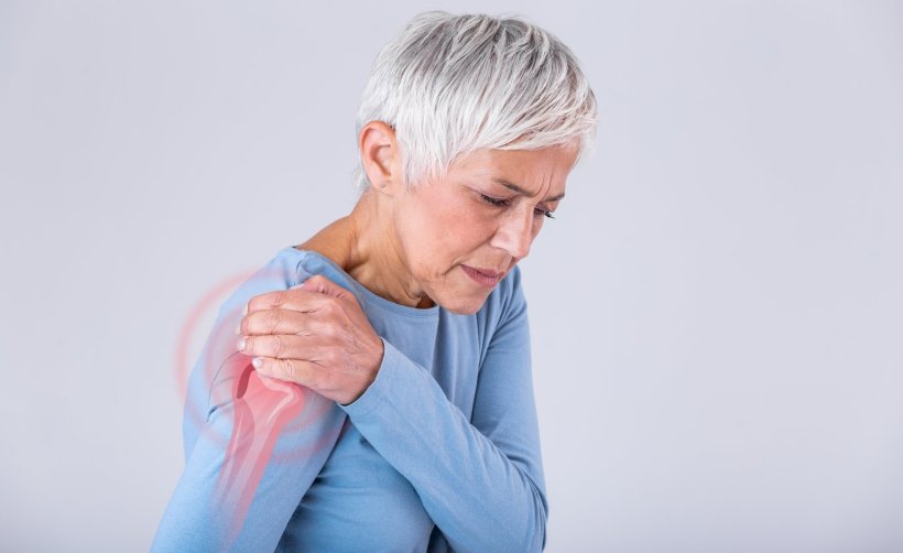 older woman having shoulder pain