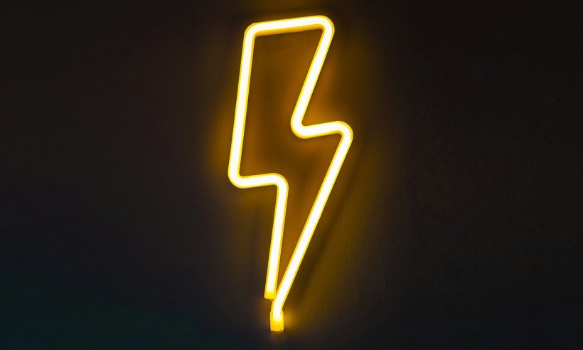 yellow neon sign shaped like lightning bolt