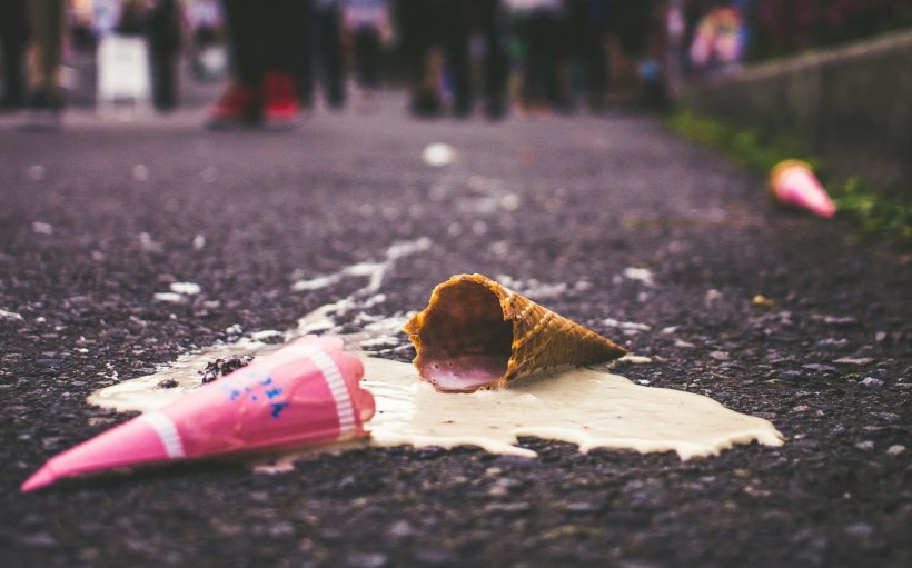 ice cream cones melting on concrete roadside