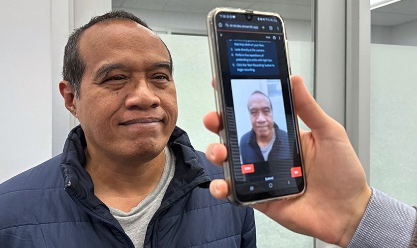 face of man being scanned for stroke symptoms with smartphone camera