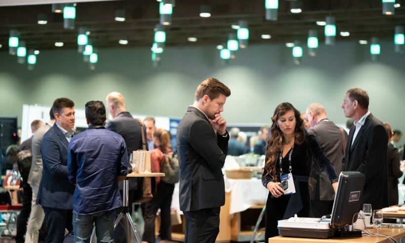 Several people in business attire at a congress