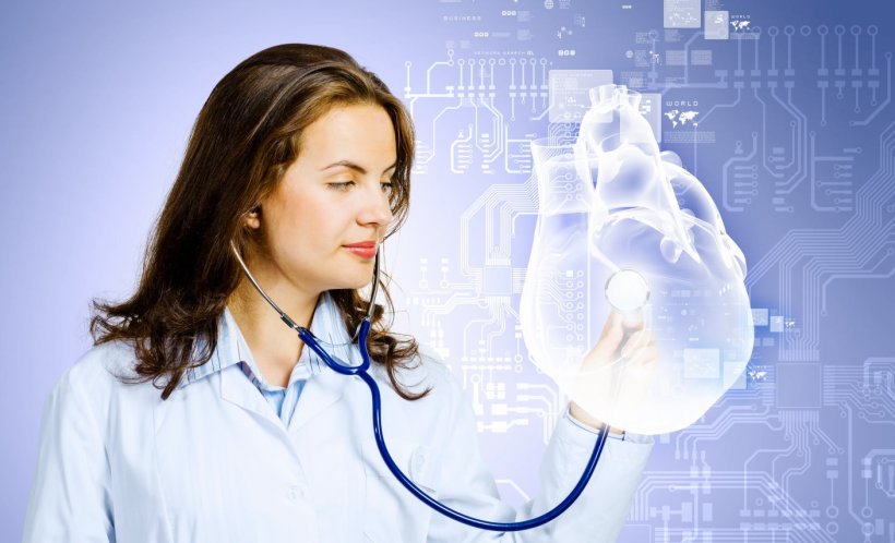 A female doctor in white coat holds stethoscope to digital representation of a...