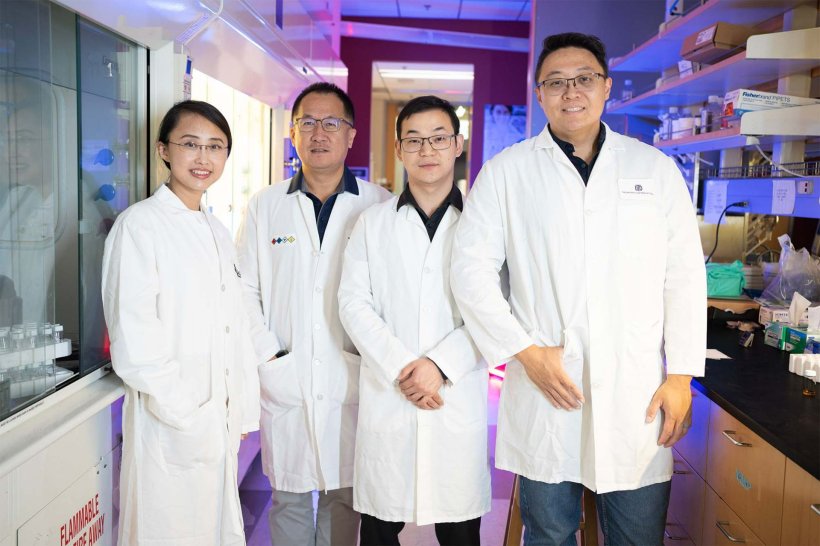 Dr. Mengxiao Yu, Dr. Jie Zheng, Yingyu Huang and Xuhui Ning standing next to...