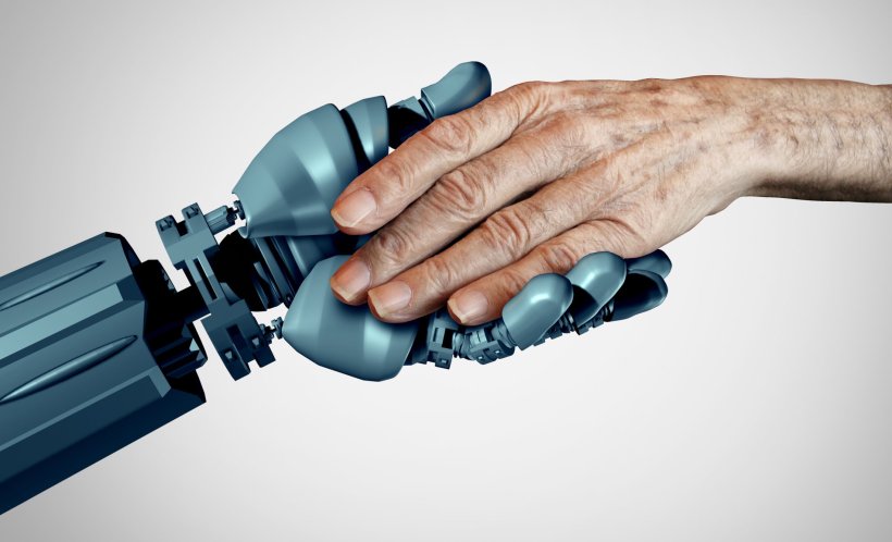 A robotic hand holding the hand of a senior person, symbolising elderly care