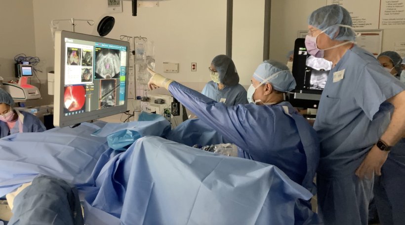 Andre Abreu, MD, a Keck Medicine of USC urologist, performs a procedure using...