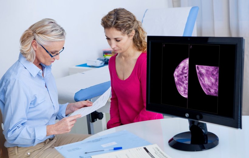 Female doctor explaining the result of a mammogram to her patient