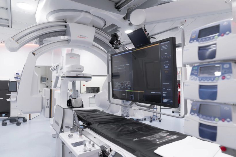 A modern hospital operating room with angiography imaging equipment