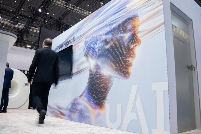 A futuristic booth display at a medical congress. It shows a digital...