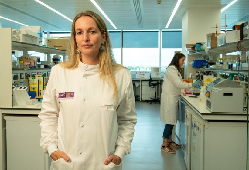 Professor Petra Hamerlik is standing in a laboratory environment, with her...