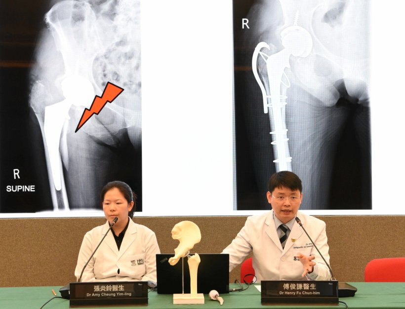 Two scientist are sitting at a green conference table, presenting study...