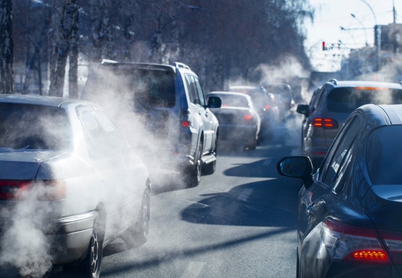 Traffic from cars on a congested road, with a lot of air pollution from fine...