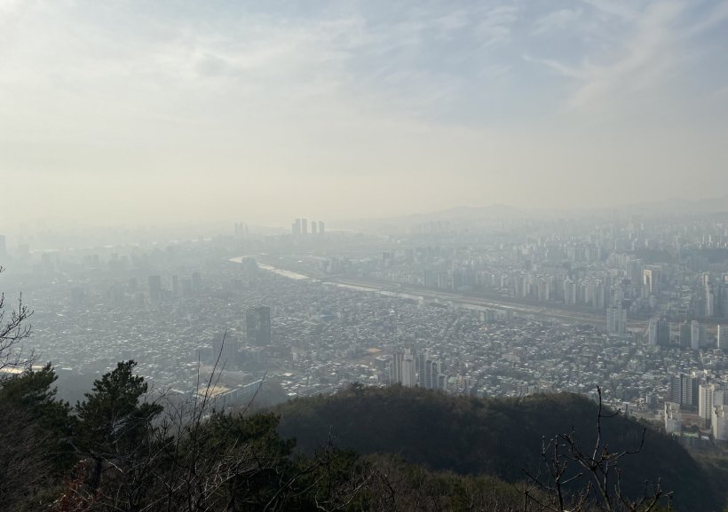 Aerial photo over the cityscape of Seoul, taken from a hill viewpoint. The air...