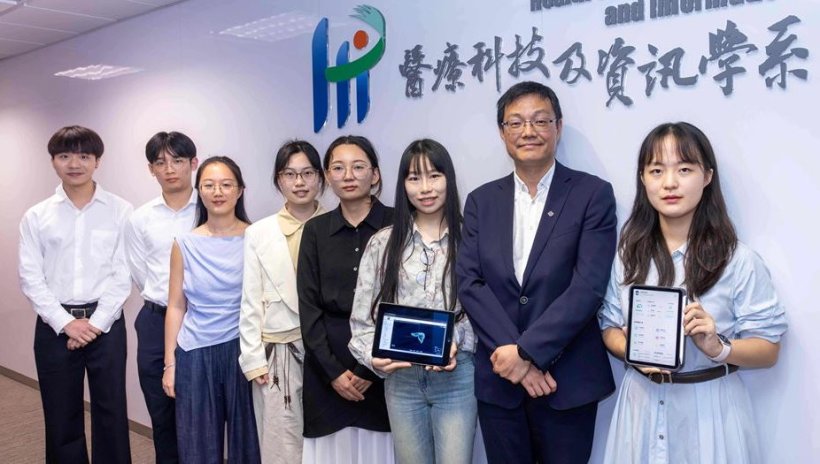 Group photo with eight persons standing in front of a white wall, with Chinese...