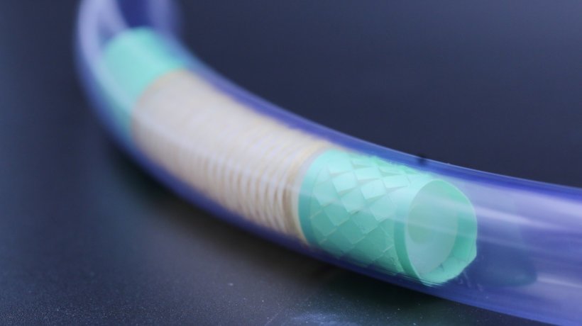 A white enteroscope in a translucent blue tube