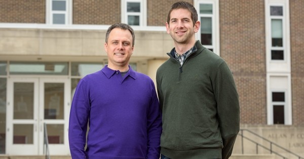 Chemical engineering professor Maciek R. Antoniewicz (left) and graduate...