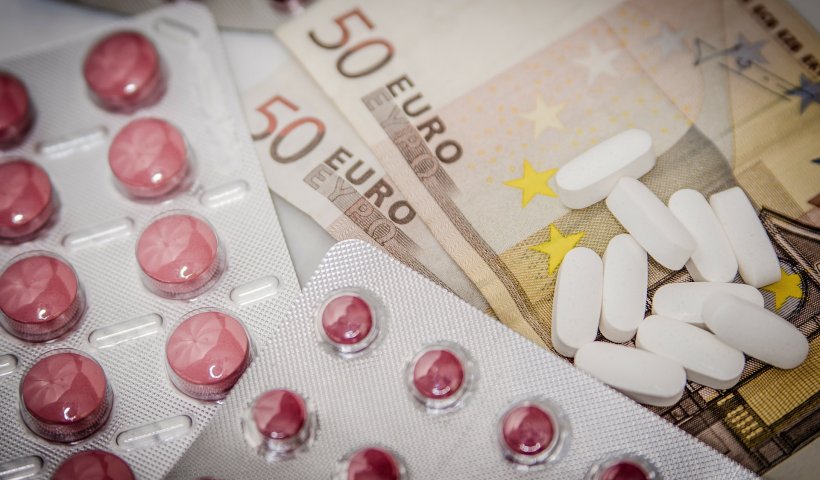 pills on top of euro bills