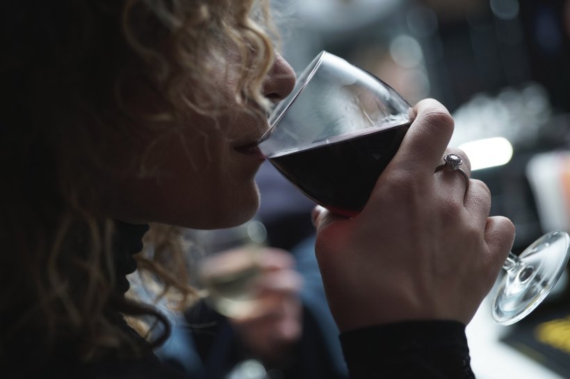 woman drinking glass of red wine