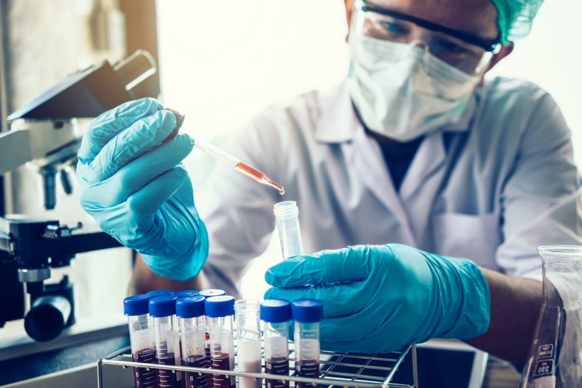 Scientist hand holding a Test tubes in a laboratory