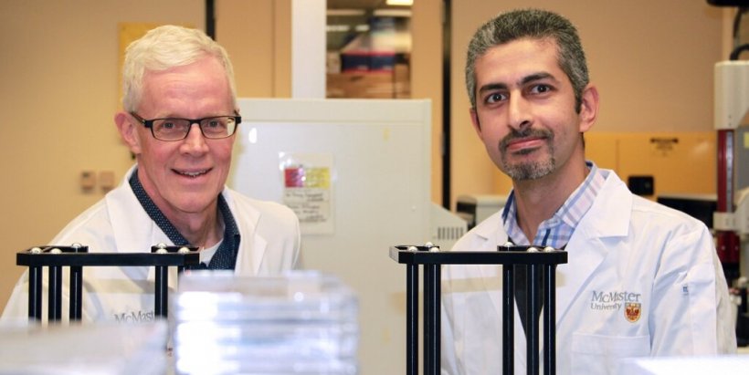 Eric Brown (left), professor of biochemistry and biomedical sciences, and Omar...