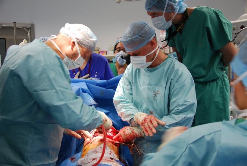 Martin Oberreiter treats a wounded soldier in the combat operating room in...