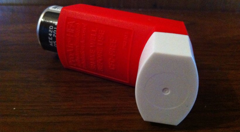 asthma medication in red inhaler