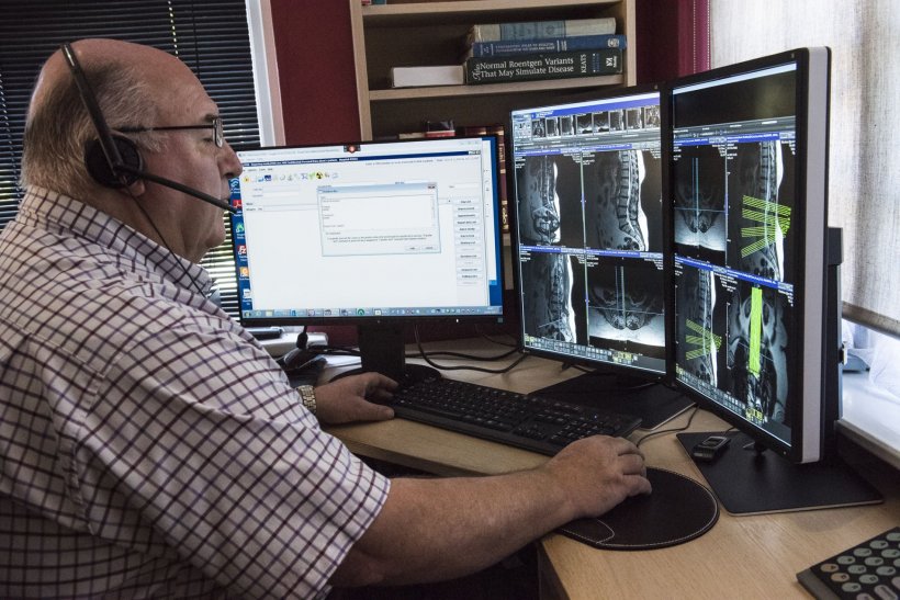 radiologist working on a teleradiology workstation