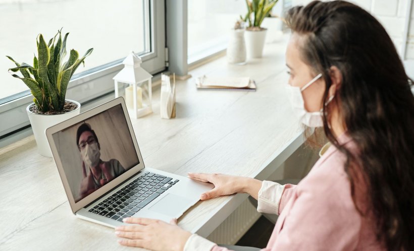 woman having video call on laptop
