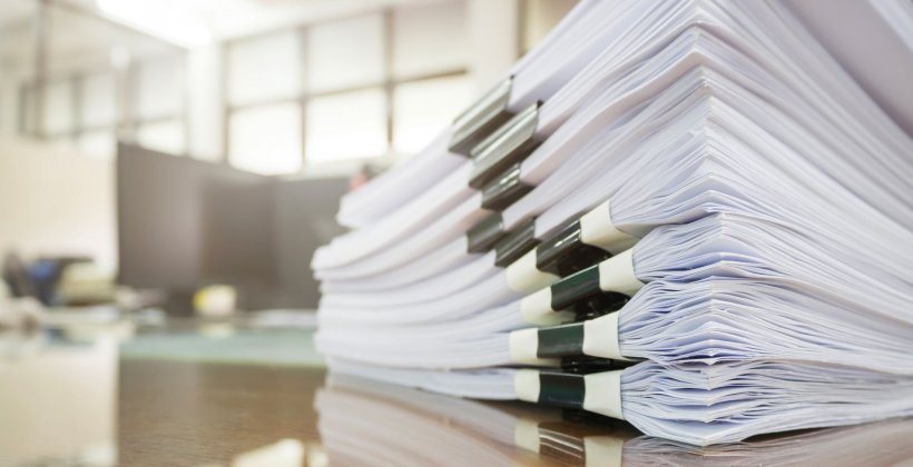 stack of files on desk