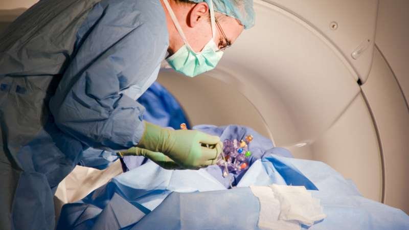 Dr. James Brad Elder performs a gene therapy brain infusion at The Ohio State...