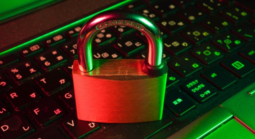 metal padlock on computer keyboard