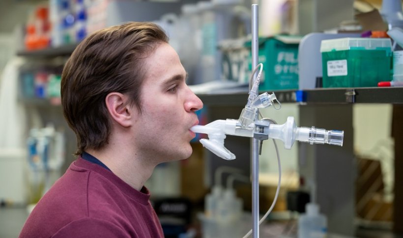 Researcher Michael D’Agostino demonstrates use of the inhaled vaccine system.