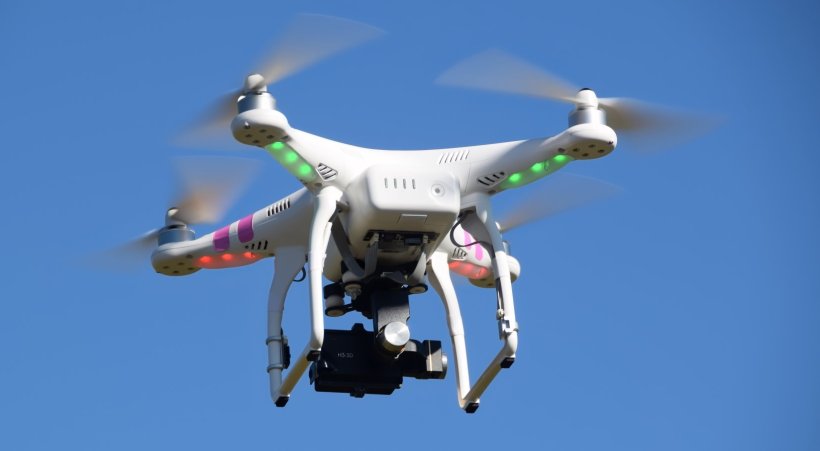 drone in-flight in blue sky