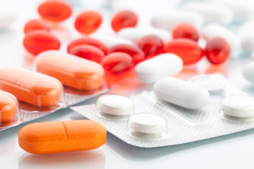 assortment of white, orange and red pills